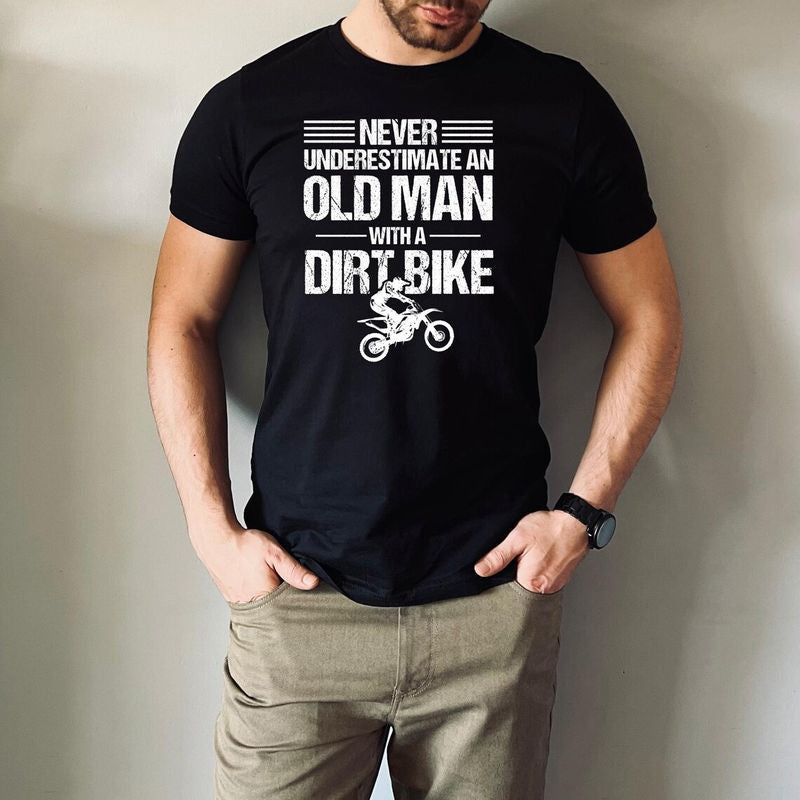 Bikergod Motorcycle Never Underestimate an Old Man with a Dirt Bike T-shirt, Crew-neck Sweatshirt, Hoodie, Tank Top, V-neck T-shirt Design 2D Full Printed Sizes S - 5XL - NAMA209